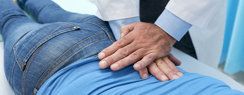 Patient receiving chiropractic care in Cumming for pain relief