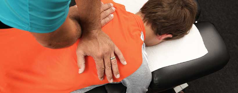 Patient receiving Drop Table Technique in Cumming for pain relief
