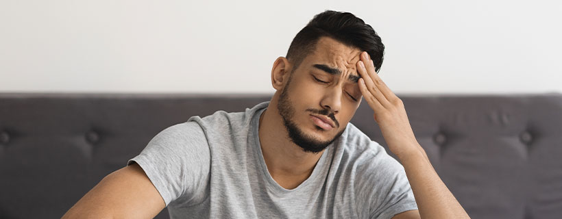 Patient suffering from Headache in need of chiropractor in Cumming